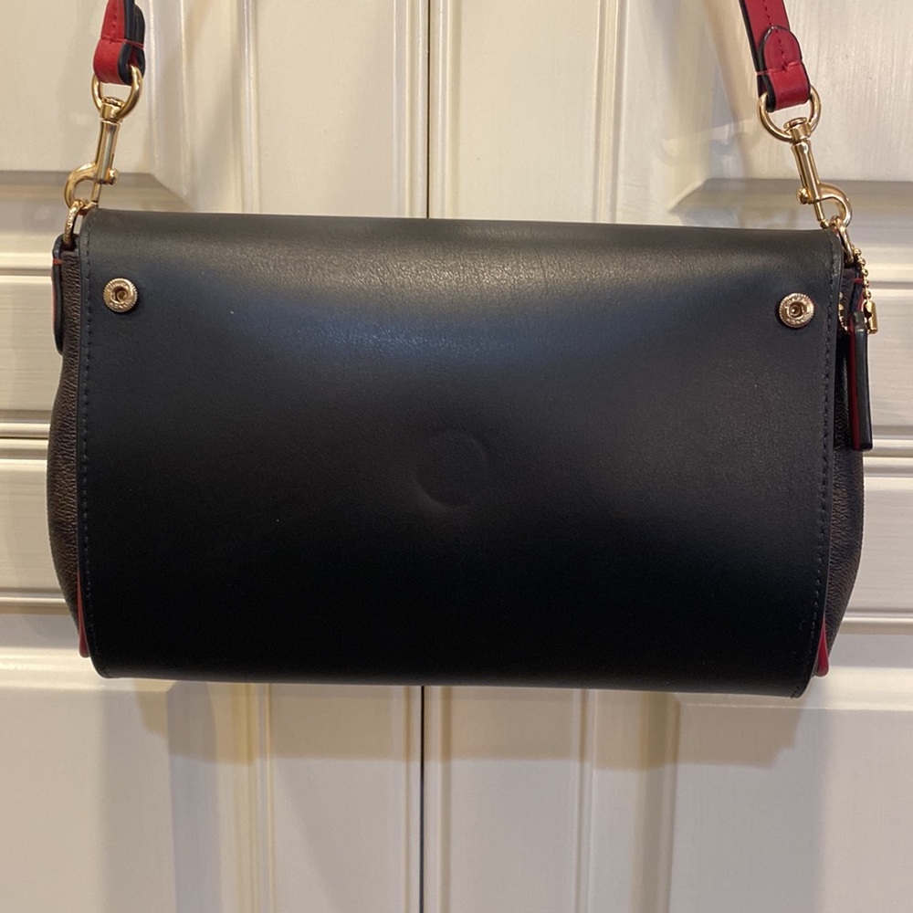 This is a like new coach cross body bag. - Picture 2 of 9